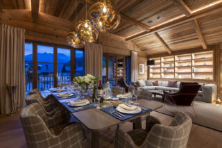 Dining and lounge space with mountain views at Chalech L in Lech