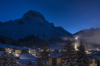 View over Lech from the Nidus apartment building at dusk in winter