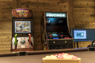 Arcade games in games room at Chalet la Loze in Méribel