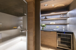 Bar and fridge next to hammam at Chalet la Loze in Méribel