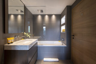 Bathroom shared between double bedroom six and children's bunk bedroom at Chalet la Loze in Méribel