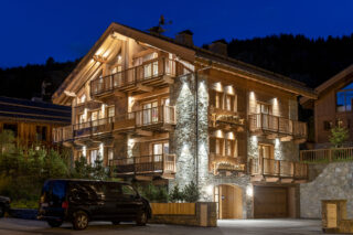Night time exterior view of Chalet la Loze in Méribel