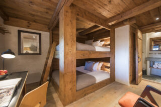 Bunk bedroom two with large beds at Chalet Bibi in Verbier