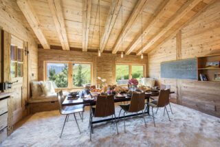 Dining room with table set for breakfast at Chalet Bibi in Verbier