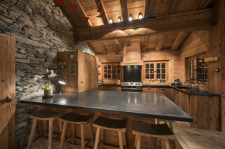 Kitchen with breakfast bar in the eveining at Chalet Bibi in Verbier