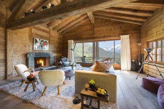 Lounge are with open fireplace at Chalet Bibi in Verbier