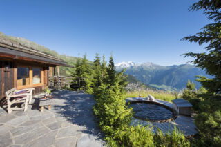 Terrace and hot tub in the garden at Chalet Bibi in Verbier