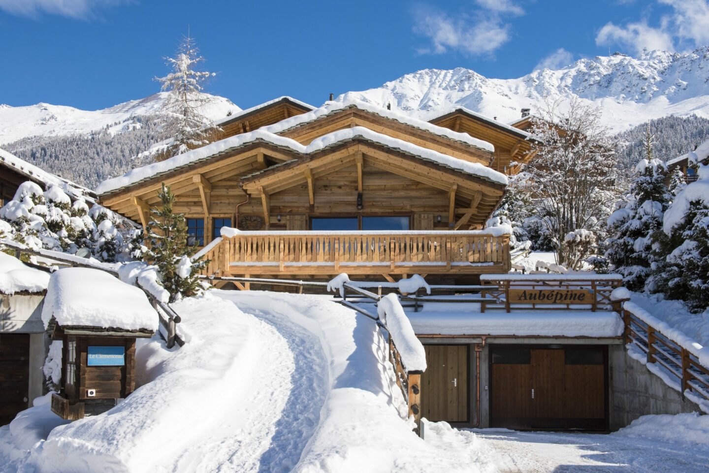 Exterior with snow and Atlas ski slopes in background at Chalet Daphne in Verbier