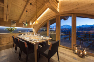 Kitchen and dining with views at Entre Ciel et Terre in Verbier