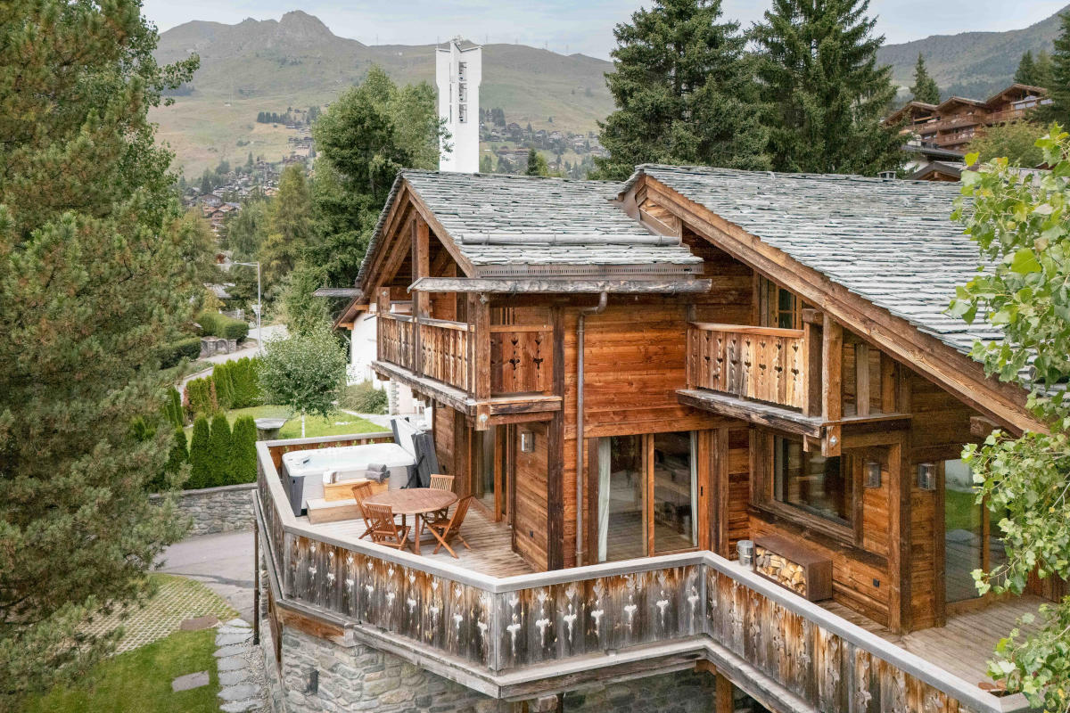 Exterior view of Chalet Feuillu in Verbier with church spire in the background