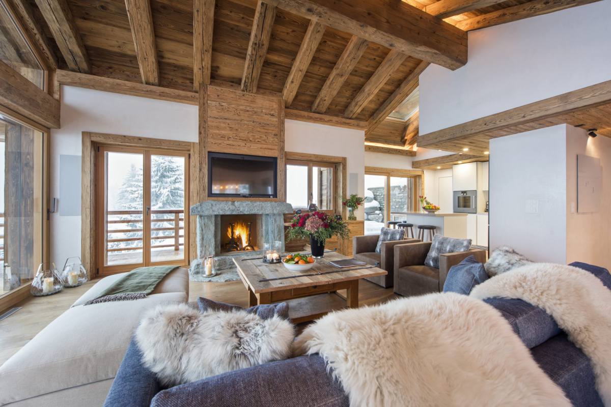 Living room with views towards kitchen at Chalet La Vigne in Verbier