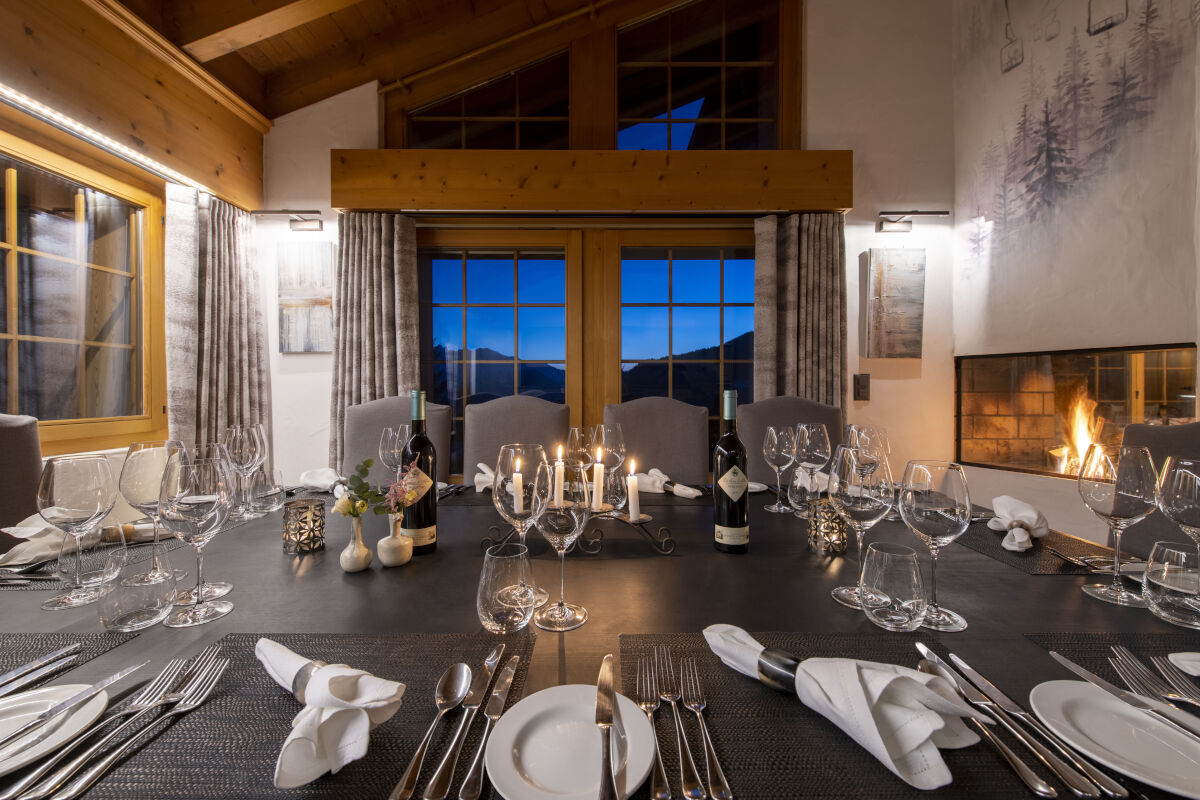 Formal dining atble with mountain views at Chalet Les Attelas in Verbier