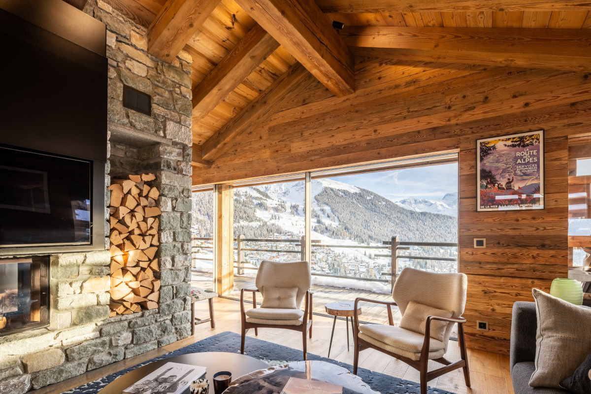 View of the village and the pistes around Carrefour and le Rouge from the living room at Chalet Petheo in Verbier