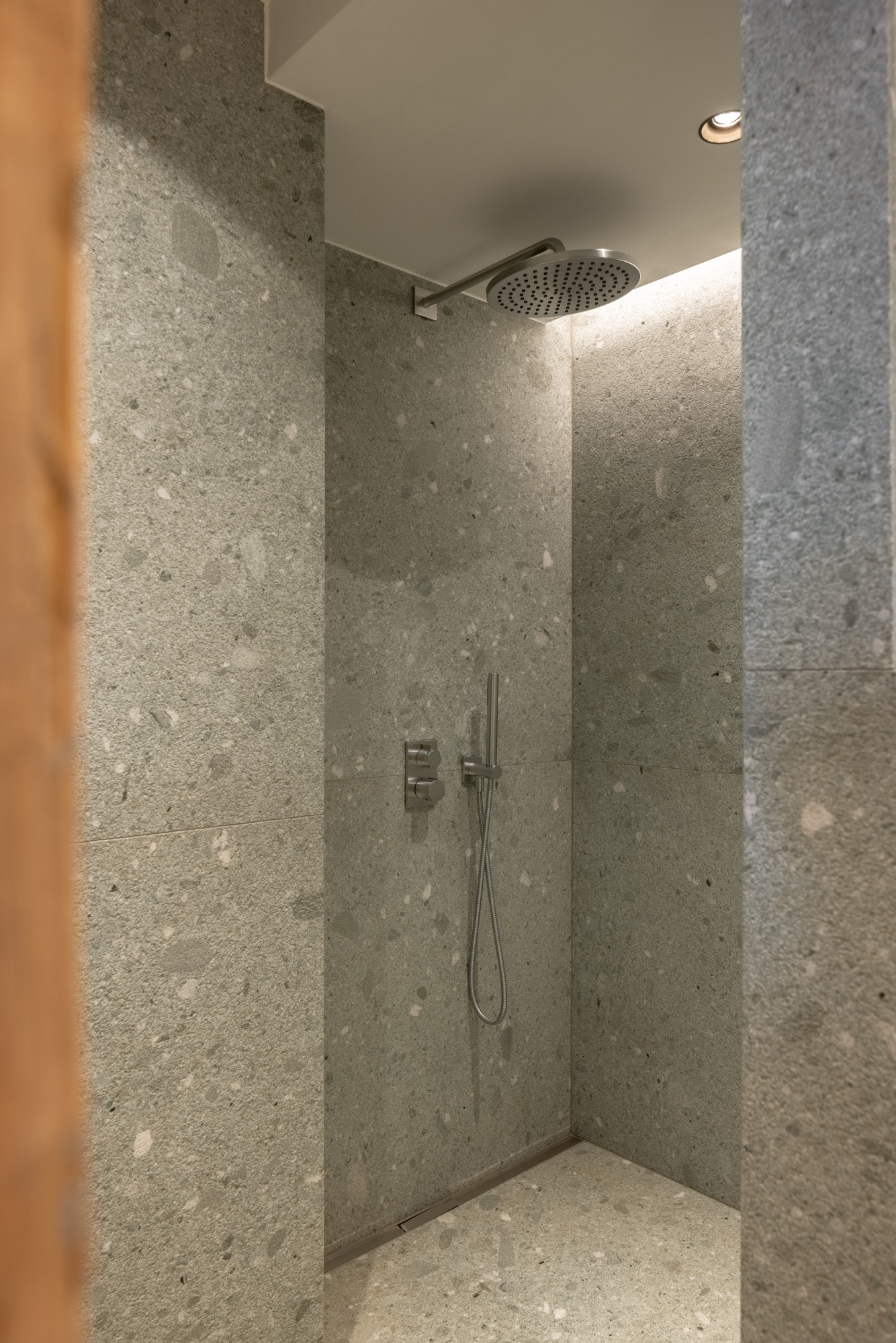 Walk-in rain shower with granite tiling in bedroom four en suite bathroom at Chalet Pierrier in Verbier