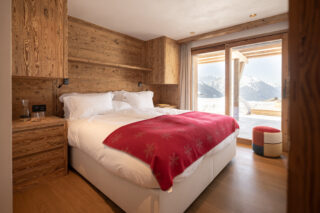 Bedroom three with terrace access at Chalet Pierrier in Verbier
