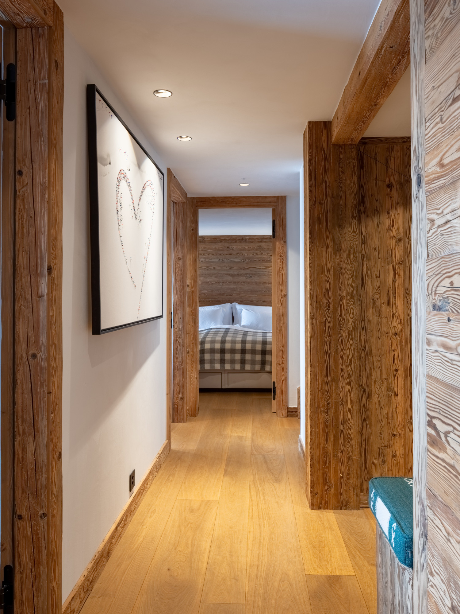 Ground floor corridor with doorway to bedroom one at Chalet Pierrier in Verbier