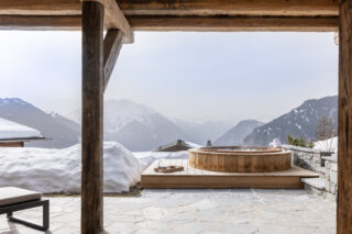 Outdoor hot tub on the terrace at Chalet Pierrier in Verbier