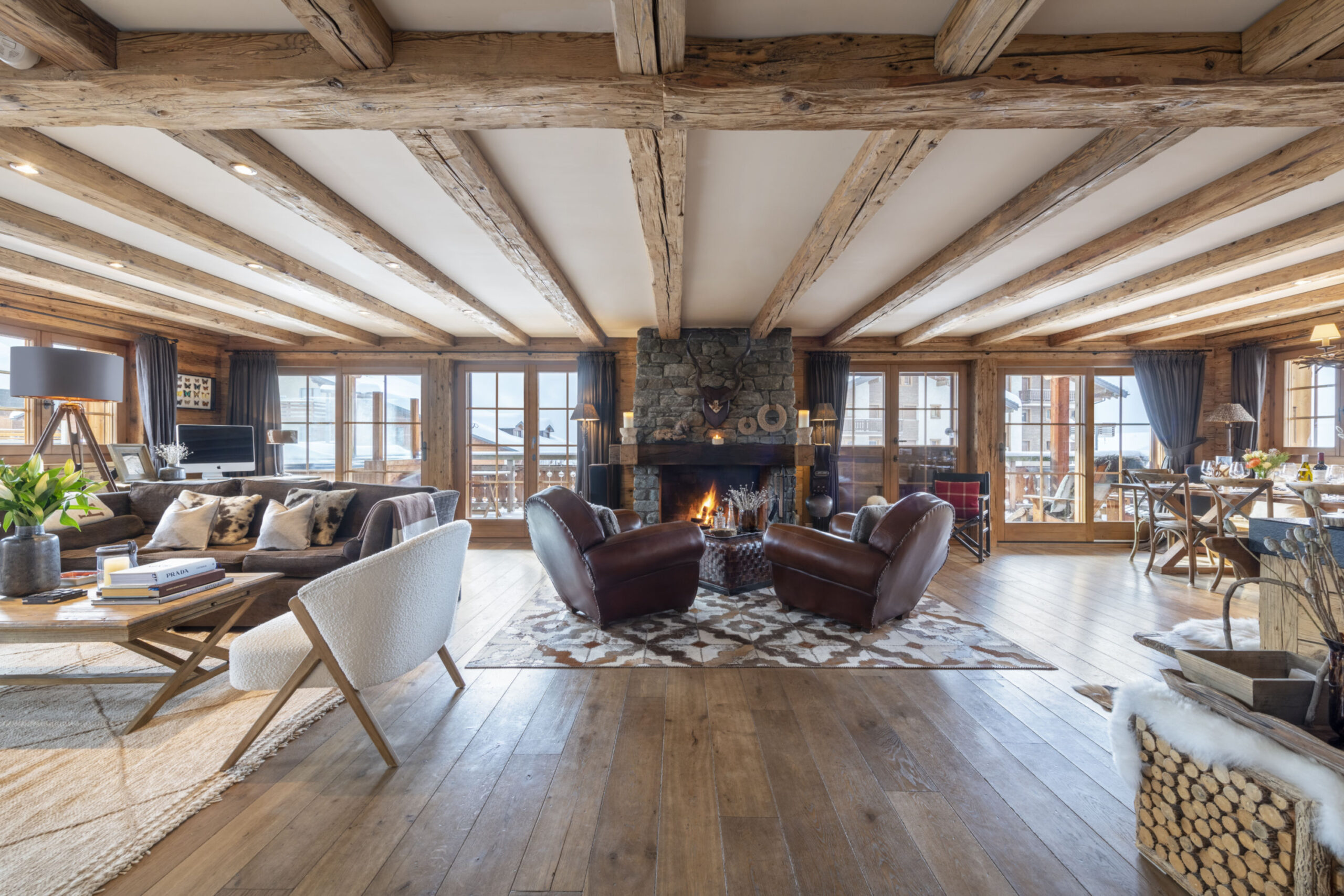 Living space with open fireplace at Apartment Silver in Verbier