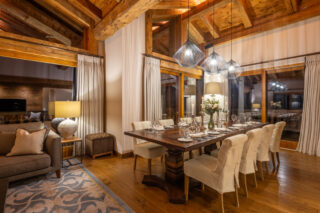 Dining area with table set for dinner at Chalet Sirocco in Verbier