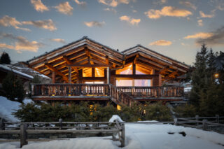 Front exterior view of Chalet Sirocco in Verbier at dusk