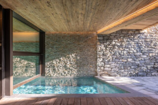 Outdoor section of swimming pool in spa area at Chalet Sirocco in Verbier