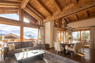 Open plan living and dining area with view of the mountains at Chalet Sirocco in Verbier