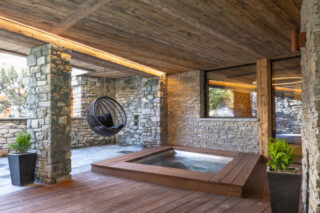 Deck outside the spa area with hot tub at Chalet Sirocco in Verbier