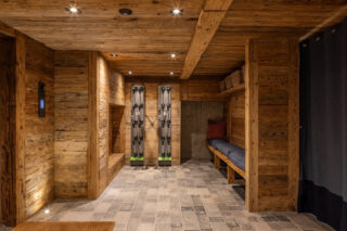 Ski room with boot drying racks at Chalet Sirocco in Verbier