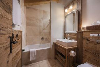 Bedroom one en suite bathroom at Penthouse Treize Etoiles in Verbier