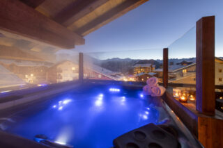 Hot tub with view over Verbier at Penthouse Trieze Etoiles