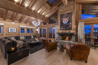 Open plan living space with French doors opening to balcony at Penthouse Treize Etoiles in Verbier