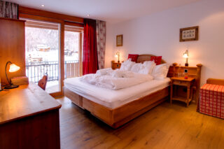 Master double bedroom at Chalet Gemini in Zermatt