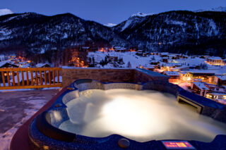 Outdoor hot tub and view over Zermatt at Chalet Gemini in Zermatt