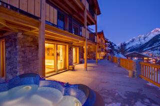 Terrace with outdoor hot tub at Chalet Gemini in Zermatt