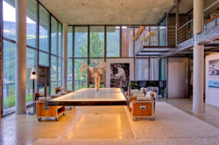 Suspended table with custom-built armchairs at the Heinz Julen Loft in Zermatt