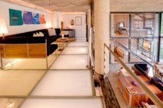Mezzanine with seating and hot tub at the Heinz Julen Loft in Zermatt