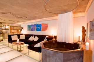 Seating and hot tub on the mezzanine at the Heinz Julen Loft in Zermatt