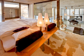 Custom-built double bed with wood surround at the Heinz Julen Loft in Zermatt