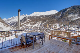View from the balcony over Zermatt on a clear winter day at the Heinz Julen Penthouse in Zermatt