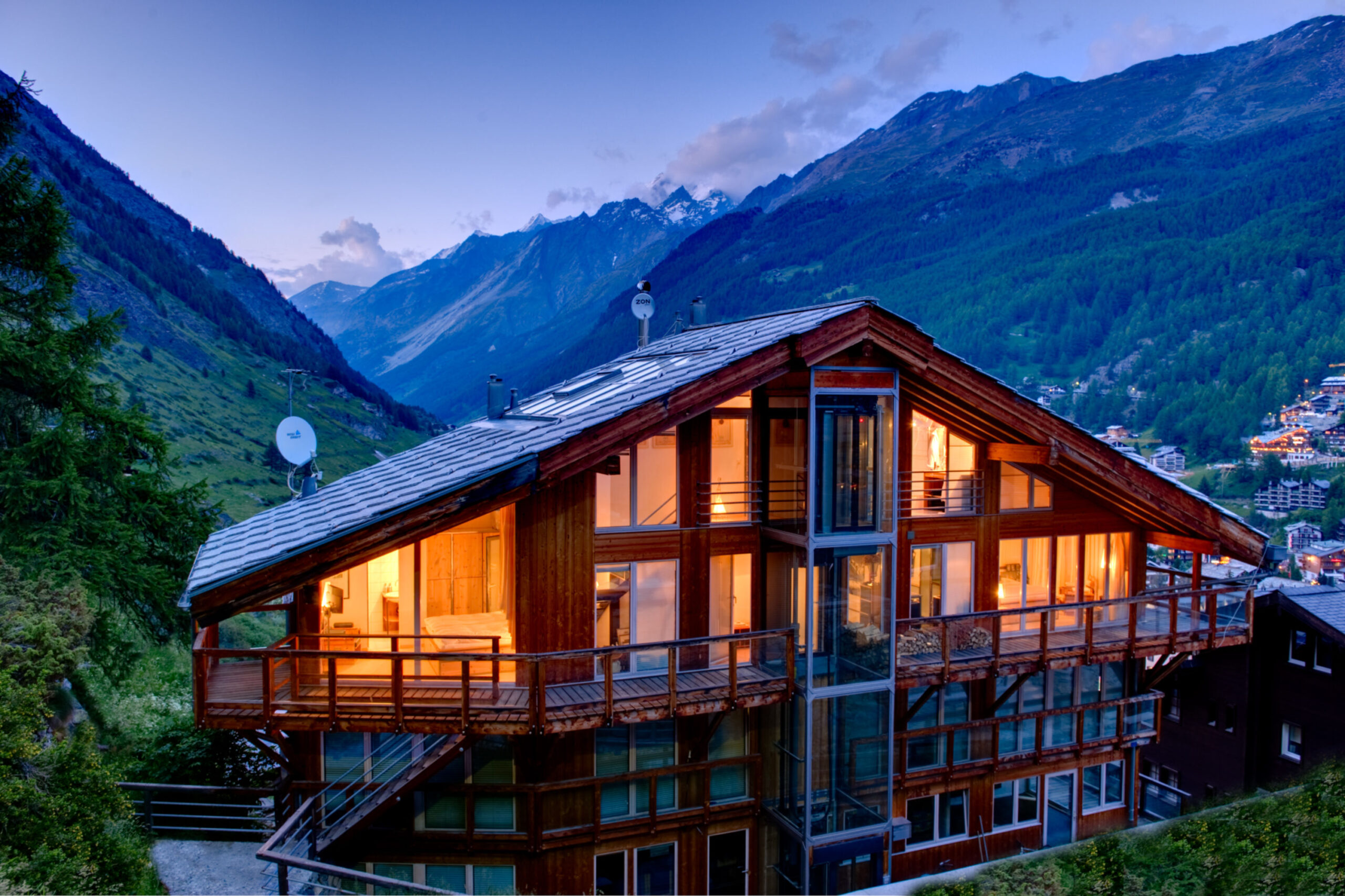 Rear exterior view of the Heinz Julen Penthouse in Zermatt at dusk