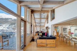Living space and dining area at the Heinz Julen Penthouse in Zermatt