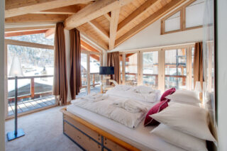 Main floor bedroom two at the Heinz Julen Penthouse in Zermatt