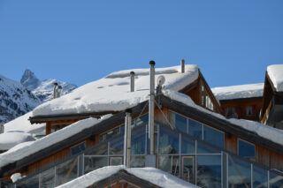 Snow-covered rooftops at the Heinz Julen Penthouse in Zermatt