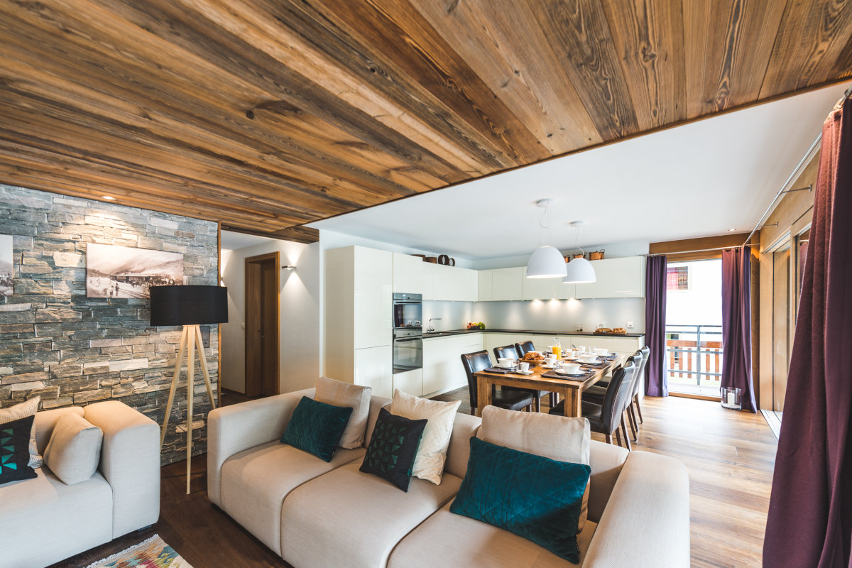 Open plan lounge, dining and kitchen space at Apartment Matten in Zermatt