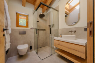 Bedroom one en suite shower room at Penthouse Weissmatten in Zermatt