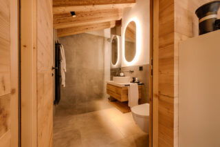 Bedroom two en suite shower room at Penthouse Weissmatten in Zermatt