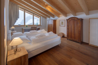 Bedroom two with view of Zermatt in the snow at Penthouse Zora