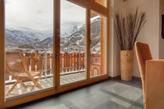 French doors to balcony with view over the resort at Penthouse Zora in Zermatt