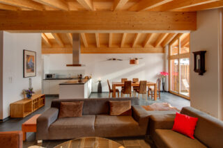 Open plan living, dining and kitchen space at Penthouse Zora in Zermatt
